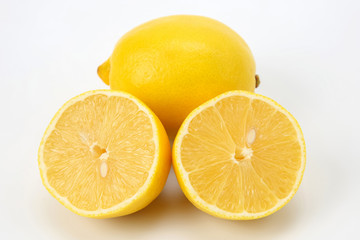 Obraz na płótnie Canvas Cut citrus fruit of lemon on white background