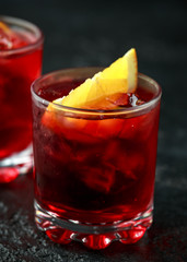 Classic Old Fashioned Negroni cocktail on rustic stone background