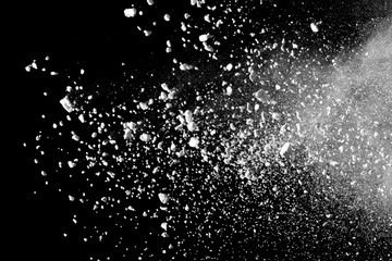 White powder explosion isolated on black background.