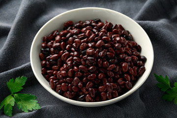 Canned Black Beans in white bowl. Healthy food