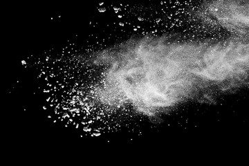 White powder explosion isolated on black background.