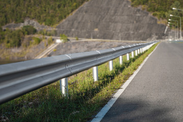 Safety steel barrier on freeway bridge designed to prevent the exit of the vehicle from the curb or bridge.