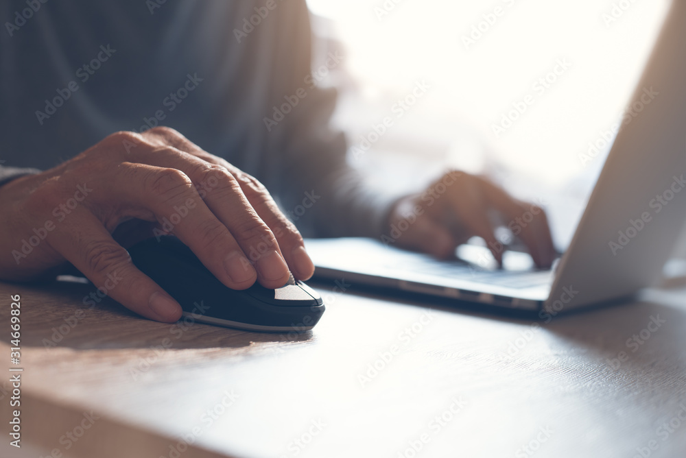 Wall mural man clicking computer mouse