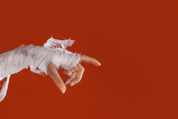 Halloween, costume image. The mummy's hand in bandages making gestures
