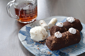 Tea with ice cream and chocolate cake