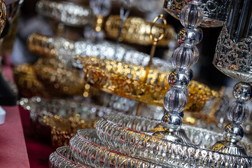 Gold silver glass chandelier lamp closeup, reflections visible on glass balls