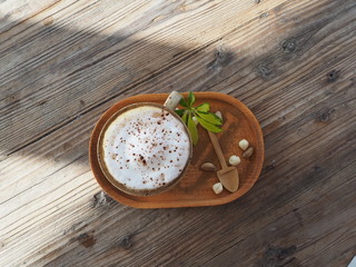 beautiful cappuccino coffe and chocolate beside