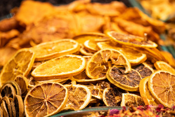 Obraz na płótnie Canvas Dried orange slices closeup, for sale at a shop at Grand Bazaar in Istanbul