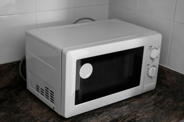 Obraz premium Microwave in a kitchen for cooking or heating a dish.