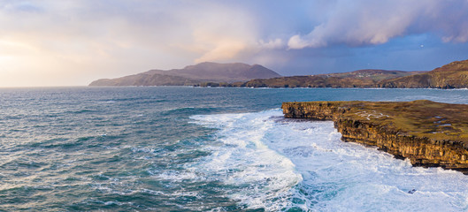 Huge waves breaking at Muckross Head - A small peninsula west of Killybegs, County Donegal, Ireland. The cliff rocks are famous for climbing