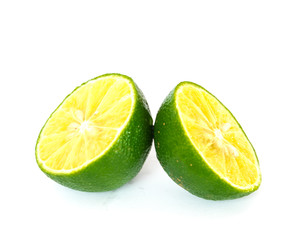Two half cut limes isolated on white