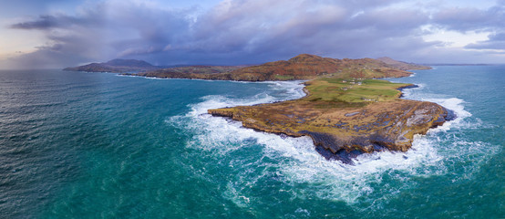 Huge waves breaking at Muckross Head - A small peninsula west of Killybegs, County Donegal, Ireland. The cliff rocks are famous for climbing