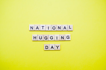 Words on plain background ; National Hugging Day.