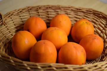 Orange juice persimmon close-up. Food background.