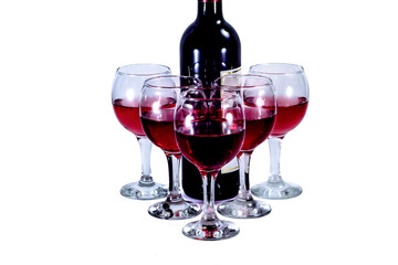 Bottle and glasses with red wine on a white background