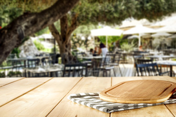 desk of free space for your decoration and blurred bar background 