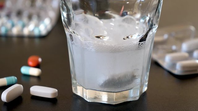 glass with water and medicament sparkling