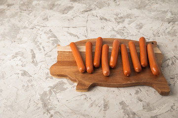 Close up of pork sausages. Sausages on the blackboard and place for text. Boiled raw bavarian...