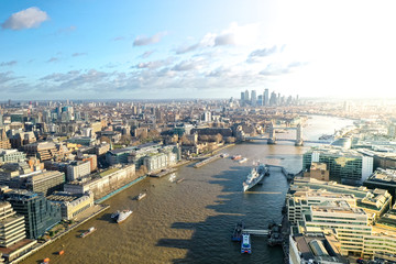 London city centre aerial panorama view: financial district, Thames river, Belfast, skyscrappers, warf and buildings and St. Pauls Cathedral, Tower Bridge and The Tower