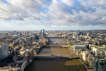 London city centre aerial panorama view: financial district, Thames river, Belfast, skyscrappers, warf and buildings and St. Pauls Cathedral, Tower Bridge and The Tower