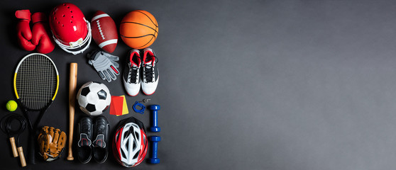 Variety Of Sports Equipment On Gray Background