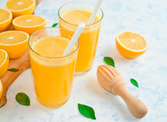 freshly squeezed orange juice and slices of orange fruit