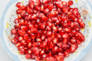 close up red pomegranate on white background  K