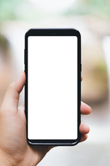 hand holding smart phone with blank screen isolated on white