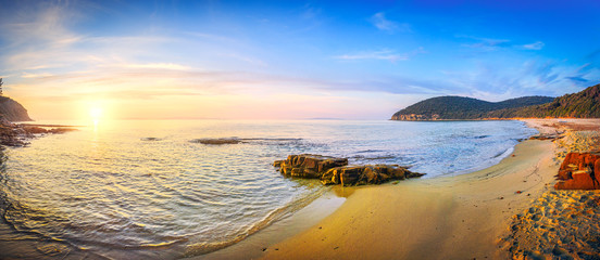 Sunset in Cala Violina bay beach in Maremma, Tuscany. Mediterranean sea. Italy.