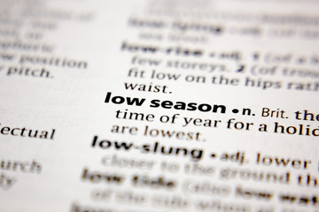 Word or phrase low season in a dictionary.
