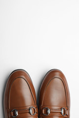 Pair of stylish male shoes isolated on white, top view