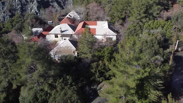 Exterior drone shot of the old abandoned hospital in Amiandos Troodos mountain.