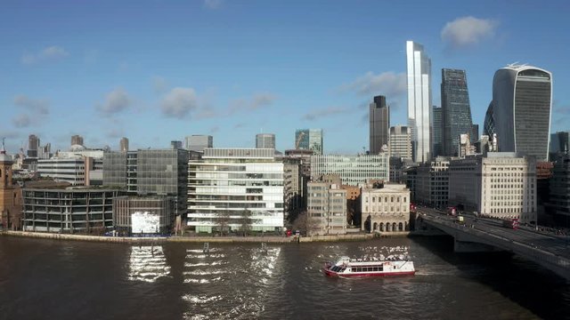 London city centre aerial panorama view: financial district, Thames river, Belfast, skyscrappers, warf and buildings and St. Pauls Cathedral, Tower Bridge and The Tower