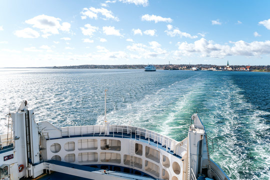 View over board of passenger ferry between Denmark and Sweden over blue sea and waves. Scandinavia cruise travel concept.
