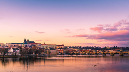 Panoramic View of Prague gothic Castle with Charles Bridge after Sunset, Czech Republic