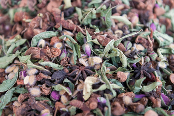 Traditional moroccan tea mixture with dried herbs, spices and rose buds.