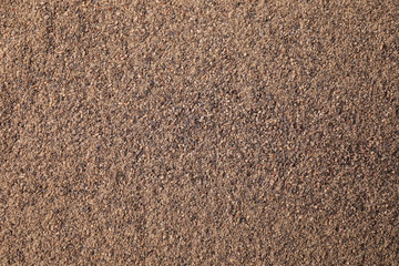 Milled black pepper as background, top view