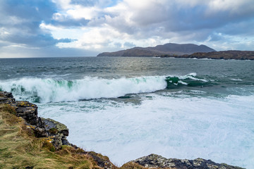 Obraz premium Huge waves breaking at Muckross Head - A small peninsula west of Killybegs, County Donegal, Ireland. The cliff rocks are famous for climbing