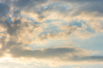 texture of the sky clouds and rays of sun on a background