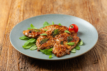 Saltimbocca. Veal schnitzel with sage and Parma ham. Italian specialty. Front view.