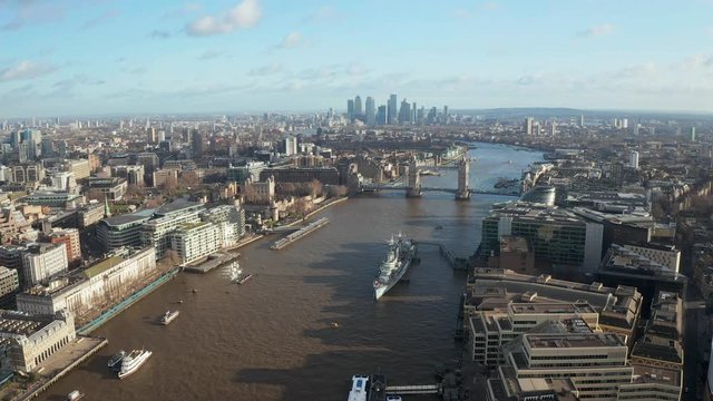 London city centre aerial panorama view: financial district, Thames river, Belfast, skyscrappers, warf and buildings and St. Pauls Cathedral, Tower Bridge and The Tower