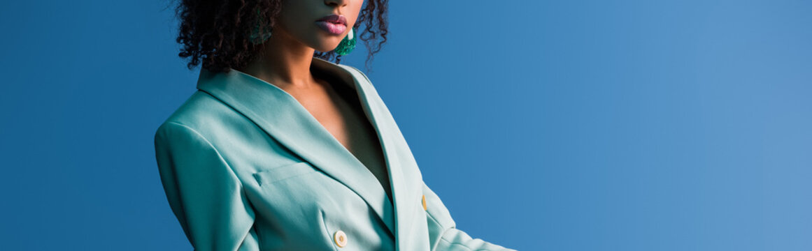 Panoramic Shot Of African American Woman In Suit Isolated On Blue