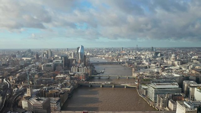 London city centre aerial panorama view: financial district, Thames river, Belfast, skyscrappers, warf and buildings and St. Pauls Cathedral, Tower Bridge and The Tower