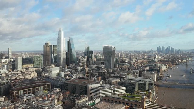 London city centre aerial panorama view: financial district, Thames river, Belfast, skyscrappers, warf and buildings and St. Pauls Cathedral, Tower Bridge and The Tower