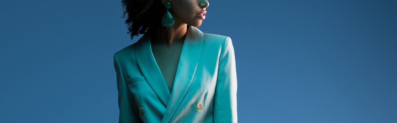  panoramic shot of african american woman in suit isolated on blue - obrazy, fototapety, plakaty