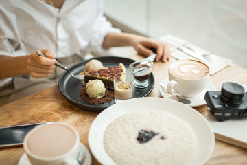 .breakfast in a cafe with porridge and delicious desserts