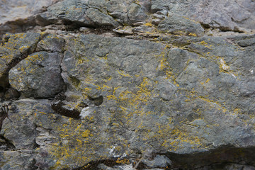The texture of natural mountain stone. Colored stone texture. Background, pattern, banner.