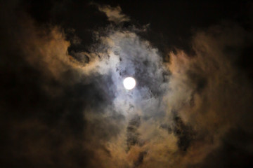 Fototapeta na wymiar Full moon with clouds, Wolf Moon in January