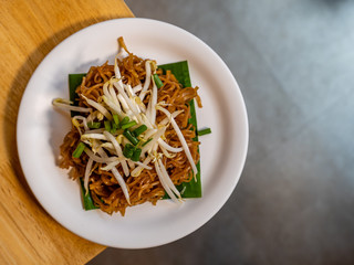 Isan Fried Rice Noodles on the wood table