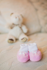  Cute little teddy bear and baby booties in white